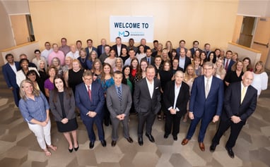Group photo of Marshall Dennehey's Pittsburgh office employees with new attorney additions from Walsh Barnes